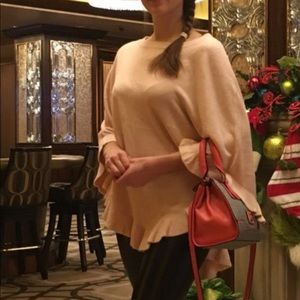 A cozy-soft poncho, sweater